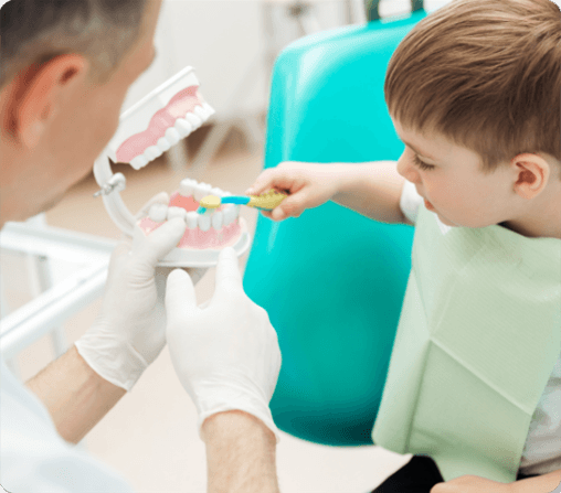 photo of smiling team member with child patient